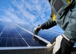 Worker holding a solar panel