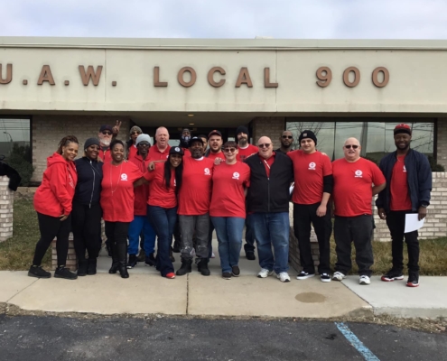 Photo of GNS workers in front of the UAW Local 900 union hall.