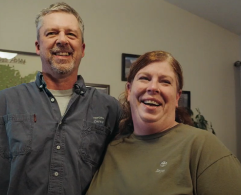 Photo of two Toyota workers.