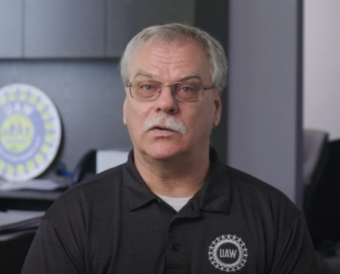 Screen shot of UAW VP Mike Booth talking about the GM Aramark tentative agreement.