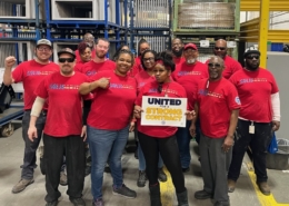 Local 5287 members who work at Thomas Built Buses in High Point, NC, wearing red shirts.