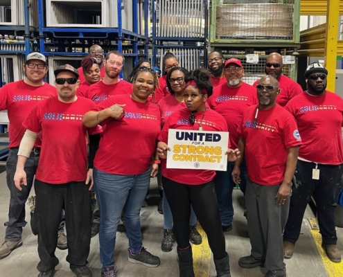 Local 5287 members who work at Thomas Built Buses in High Point, NC, wearing red shirts.