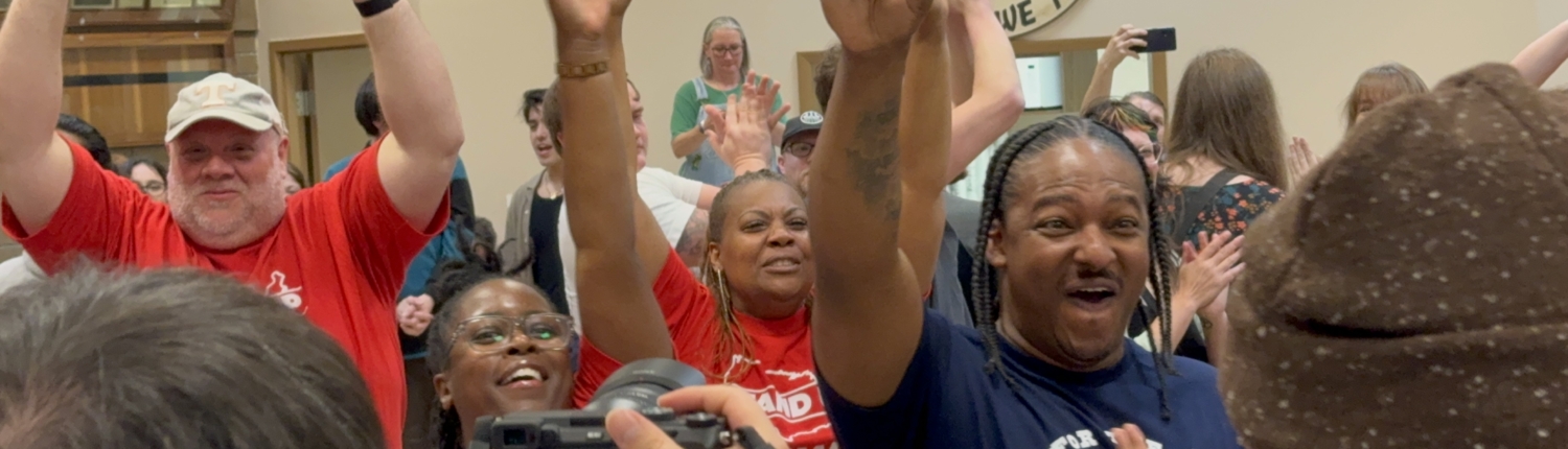 Photo of workers at the Volkswagen plant in Chattanooga, TN, celebrating after they voted overwhelmingly to join the UAW.