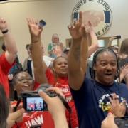 Photo of workers at the Volkswagen plant in Chattanooga, TN, celebrating after they voted overwhelmingly to join the UAW.