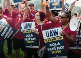 Photo of UAW members at a rally in Detroit, MI, heading into the 2023 Stand Up Strike.