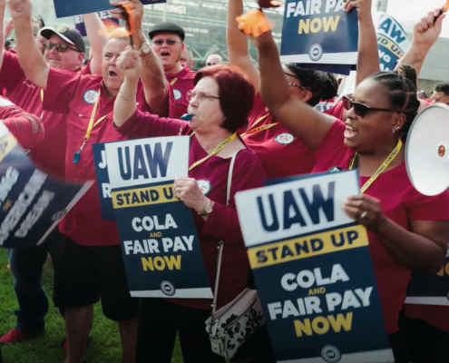 Photo of UAW members at a rally in Detroit, MI, heading into the 2023 Stand Up Strike.