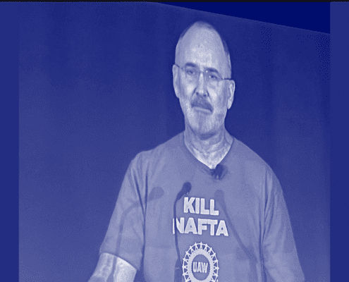 Photo of UAW President Shawn Fain wearing a "Kill NAFTA" t-shirt during the union's recent town hall.