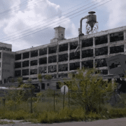 Photo of a destroyed shut down auto assembly plant.