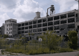 Photo of a destroyed shut down auto assembly plant.