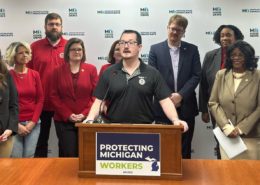 Photo of UAW Local 228 member JJ Jewell addressing the media during a Michigan House Democrats press conference introducing the May Day bill package to expand workers’ rights on May 1, 2025.