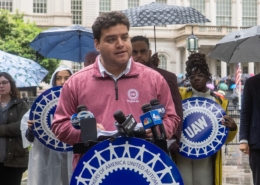 Photo of UAW Region 9A Director Brandon Mancilla addressing the media during an anti-Andrew Cuomo press conference in front of New York City Hall.