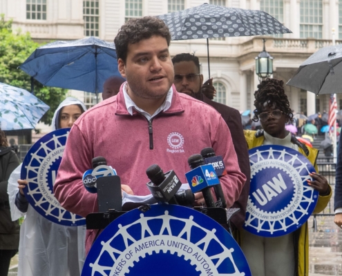 Photo of UAW Region 9A Director Brandon Mancilla addressing the media during an anti-Andrew Cuomo press conference in front of New York City Hall.