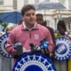 Photo of UAW Region 9A Director Brandon Mancilla addressing the media during an anti-Andrew Cuomo press conference in front of New York City Hall.
