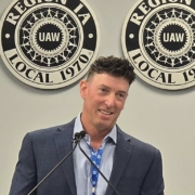 Photo of UAW Local 600 1st Vice President Mark DePaoli addressing Region 1A delegates after being elected the region's new director.