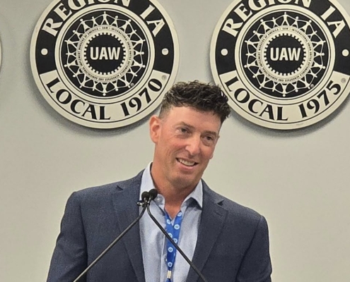 Photo of UAW Local 600 1st Vice President Mark DePaoli addressing Region 1A delegates after being elected the region's new director.