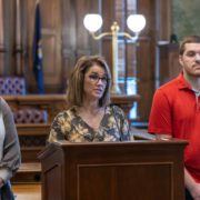 Unprocessed Unemployment Claims, Frozen Medicaid, and Public Safety Risks: UAW Members at the State of Michigan Outline Alarming Risks of Looming Shutdown Local 6000 President Rachael Dickinson addresses the media on September 16, 2025, regarding a looming Michigan government shut down. Brandi Jenkins, Rehabilitation Counselor with Michigan Rehabilitation Services under the Department of Labor Economic Opportunity (LEO) is to the left of Dickinson and Ray Hesser, Child Protective Services (CPS) Worker, DHHS from Flint is on the right.