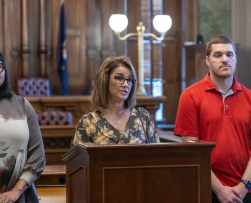 Local 6000 President Rachael Dickinson addresses the media on September 16, 2025, regarding a looming Michigan government shut down. Brandi Jenkins, Rehabilitation Counselor with Michigan Rehabilitation Services under the Department of Labor Economic Opportunity (LEO) is to the left of Dickinson and Ray Hesser, Child Protective Services (CPS) Worker, DHHS from Flint is on the right.
