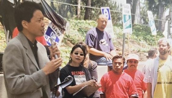 Photo of labor and human rights activist Kent Wong speaking at a 1995 UAW recognition strike at UCLA.