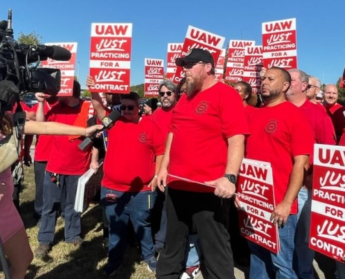 Photo of UAW Local 42 members speaking with the media during a practice picket at Volkswagen in Chattanooga, TN, on October 22, 2025.