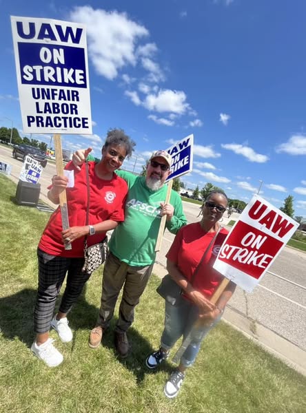 UAW Local 96 Mercy Clinic East Workers on strike posing together for a photo