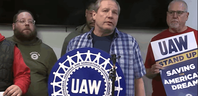 Photo of UAW Local 2359 members speaking with the media on Conn-Selmer's decision to close its plant in Eastlake, OH.