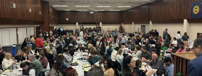 Members sitting inside meeting hall.