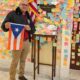 UAW Region 9A member holding a Puerto Rican flag lobbies on Capitol Hill in Washington, D.C., on February 11, 2026.