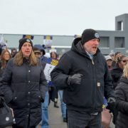 REGION 2B-LOCAL 2192- LORAIN COUNTY JOBS AND FAMILY SERVICES UAW Members picketing, wearing winter attire, holding signs, in front of county building,