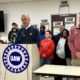 UAW President Shawn Fain addresses the media during a press conference announcing a potential strike at Lorain County Jobs and Family Services on February 16, 2026.