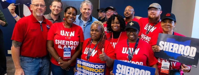 Photo of UAW members with Sherrod Brown in October 2026.